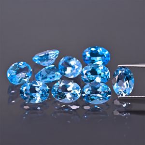 Oválny kameň, kužeľ - topás Swiss Blue 7x5 MM