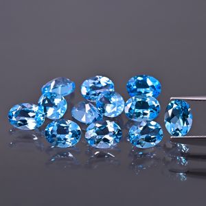 Oválny kameň, kužeľ - topás Swiss Blue 7x5 MM